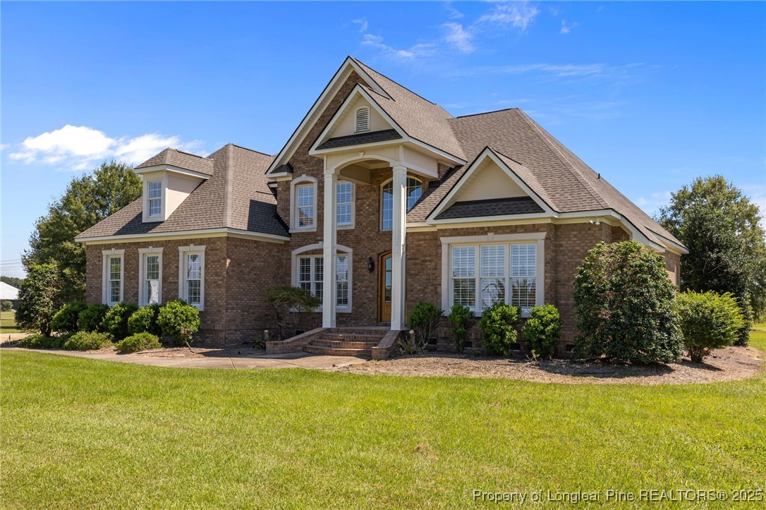 8224 Highway 210 Angier, NC 27501 - Photo 49 of 50 a front view of a house with a yard