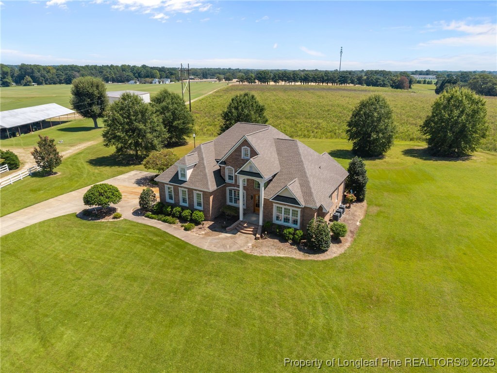 8224 Highway 210 Angier, NC 27501 - Photo 5 of 50 a view of a lake with a house in the background