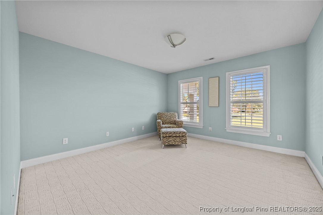 8224 Highway 210 Angier, NC 27501 - Photo 8 of 50 a room with a window and a fan