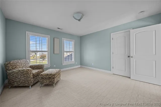 a room with a bed and a window