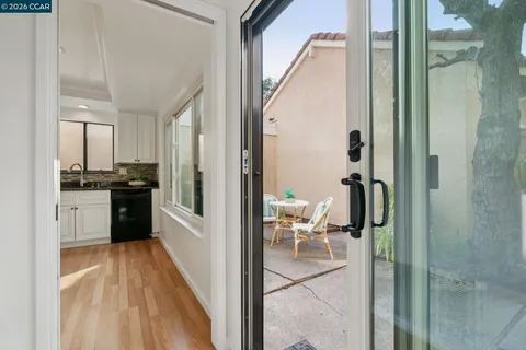 a kitchen with a refrigerator and a sink
