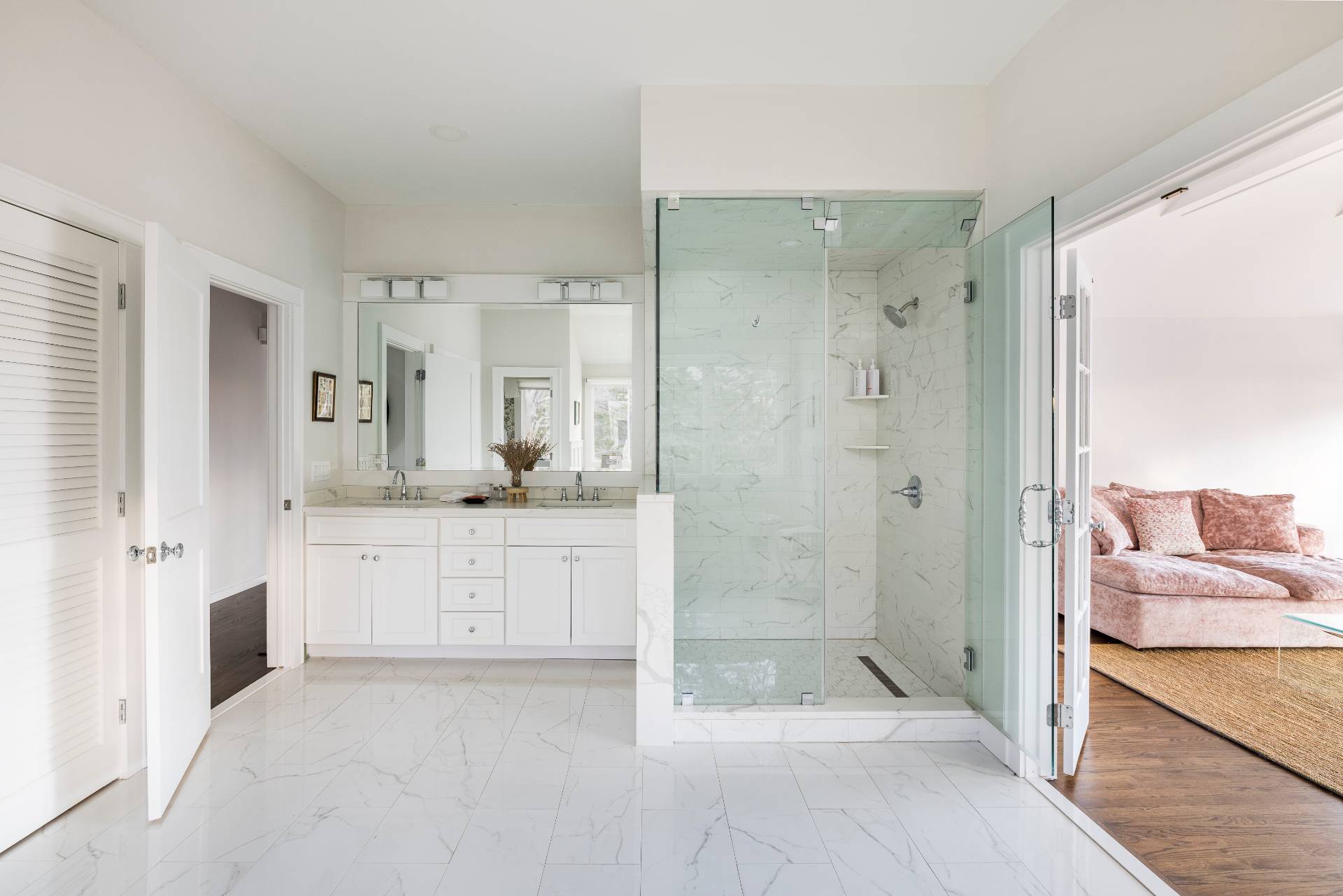 29 Petrel Road Southampton, NY 11968 - Photo 15 of 28 a bathroom with a granite countertop sink mirror and shower
