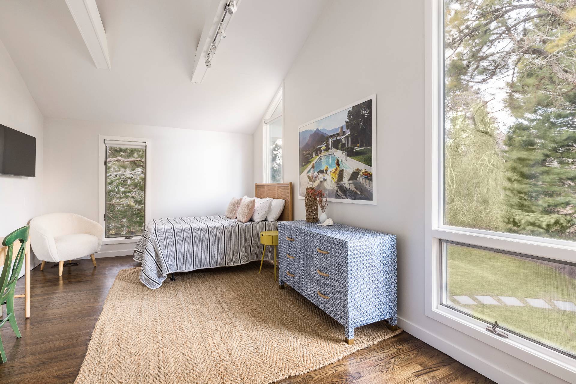 29 Petrel Road Southampton, NY 11968 - Photo 17 of 28 a bedroom with furniture and a window