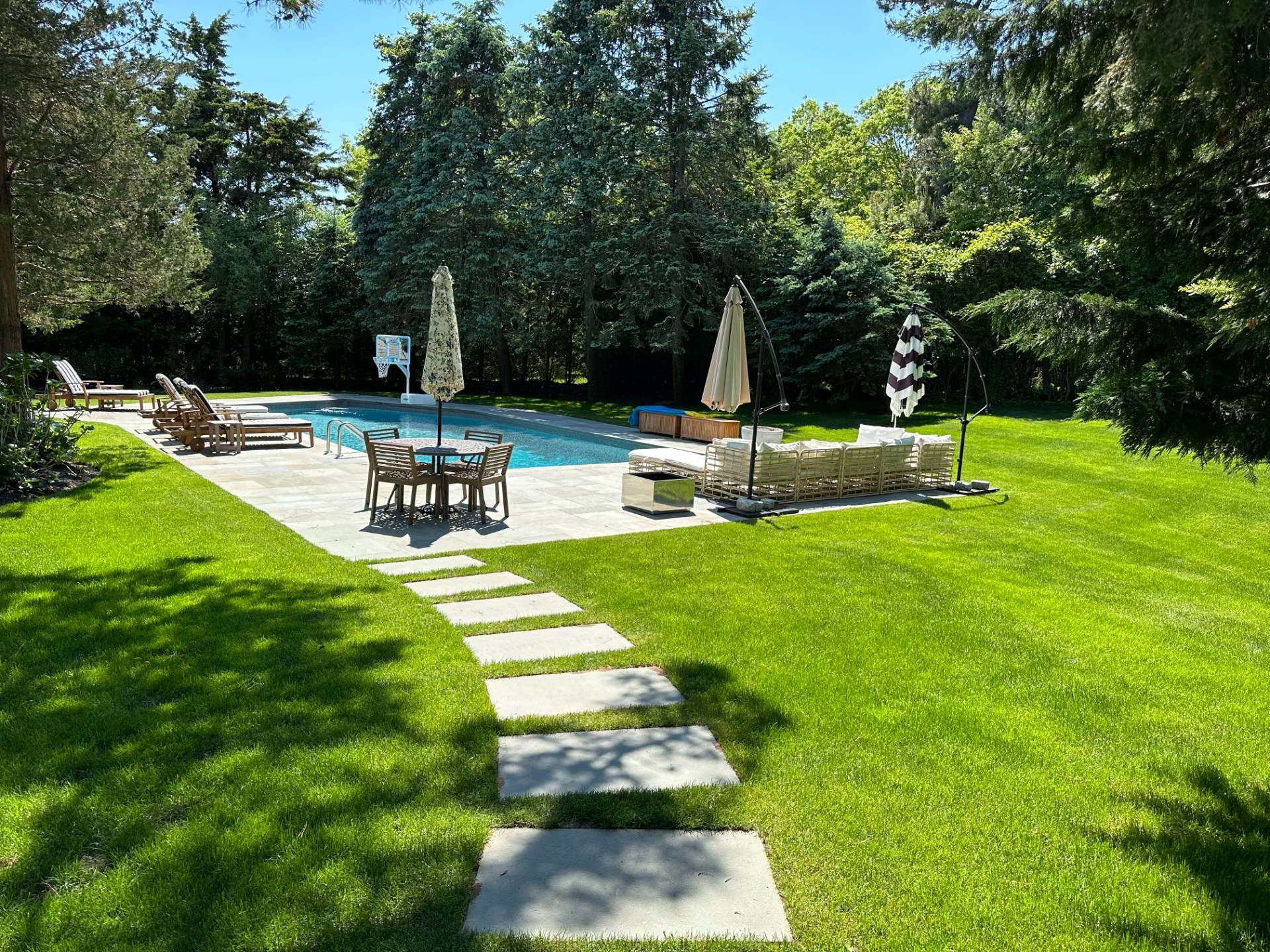 29 Petrel Road Southampton, NY 11968 - Photo 25 of 28 a view of a backyard with sitting area
