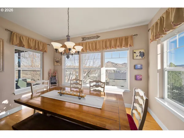 a dining room with furniture and window
