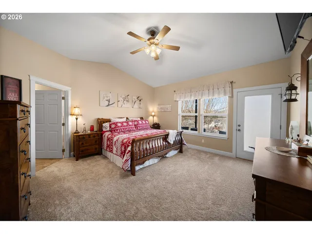 a bedroom with a bed and a table