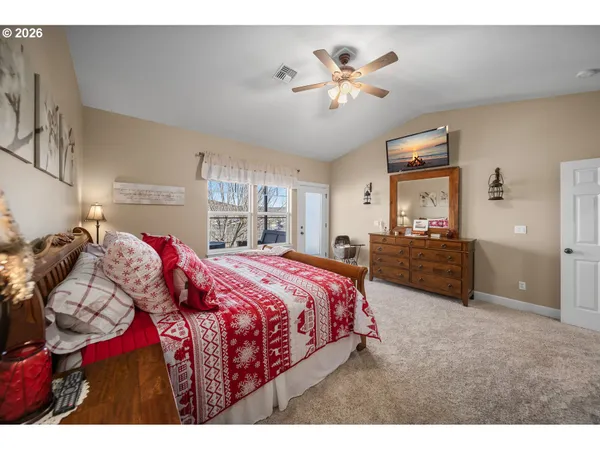 a bed room with a bed and a chandelier