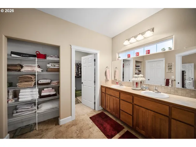 a kitchen with kitchen island white cabinets and appliances