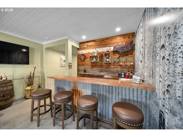 a kitchen view with table and chairs