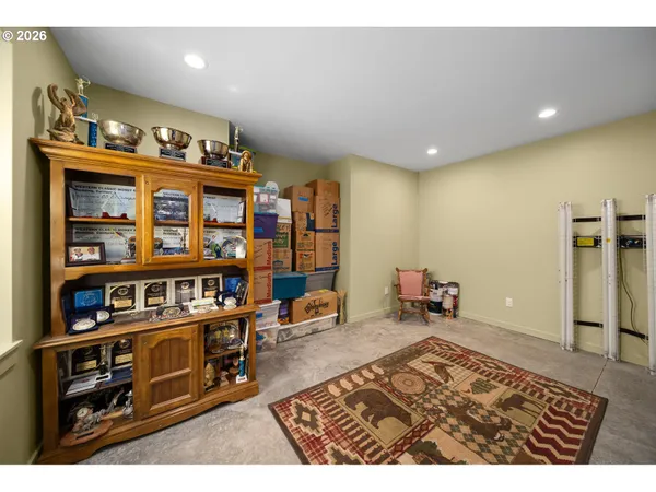 a living room with lots of furniture and a book shelf