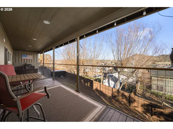 a view of a balcony with chairs