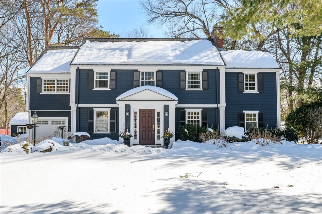 a front view of a house with yard patio and fire pit