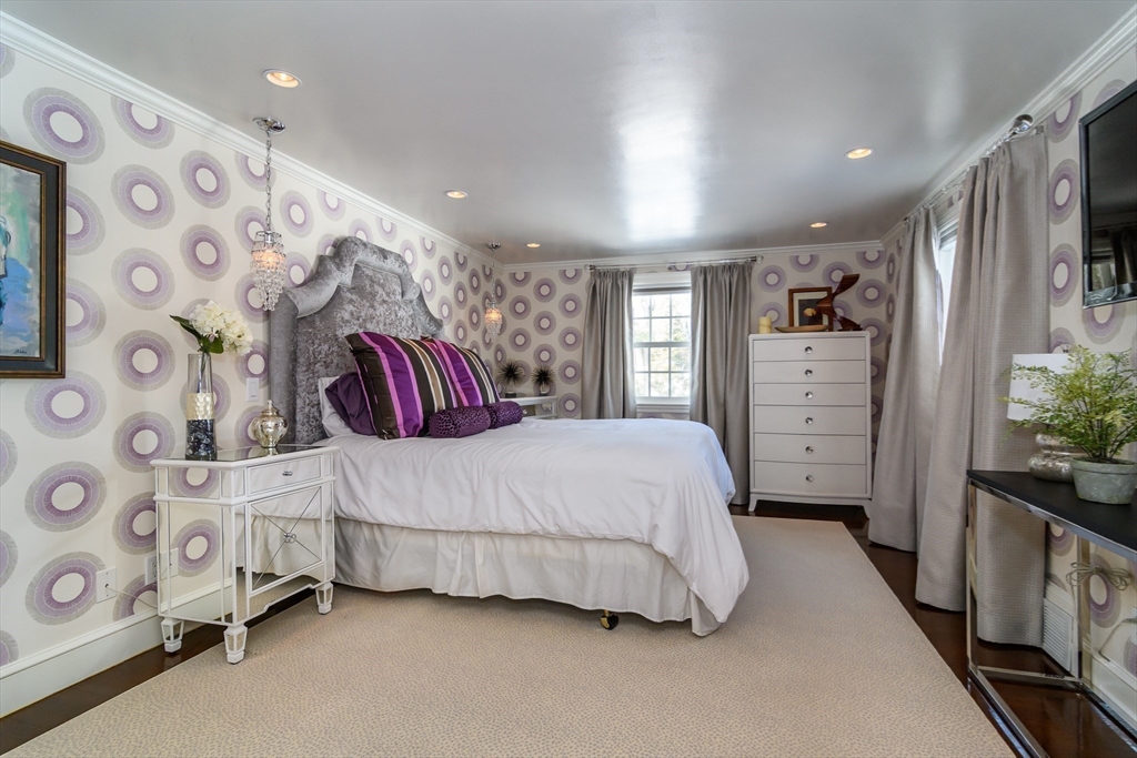 81 Audubon Road Wellesley, MA 02481 - Photo 12 of 25 a bedroom with a bed closet and window