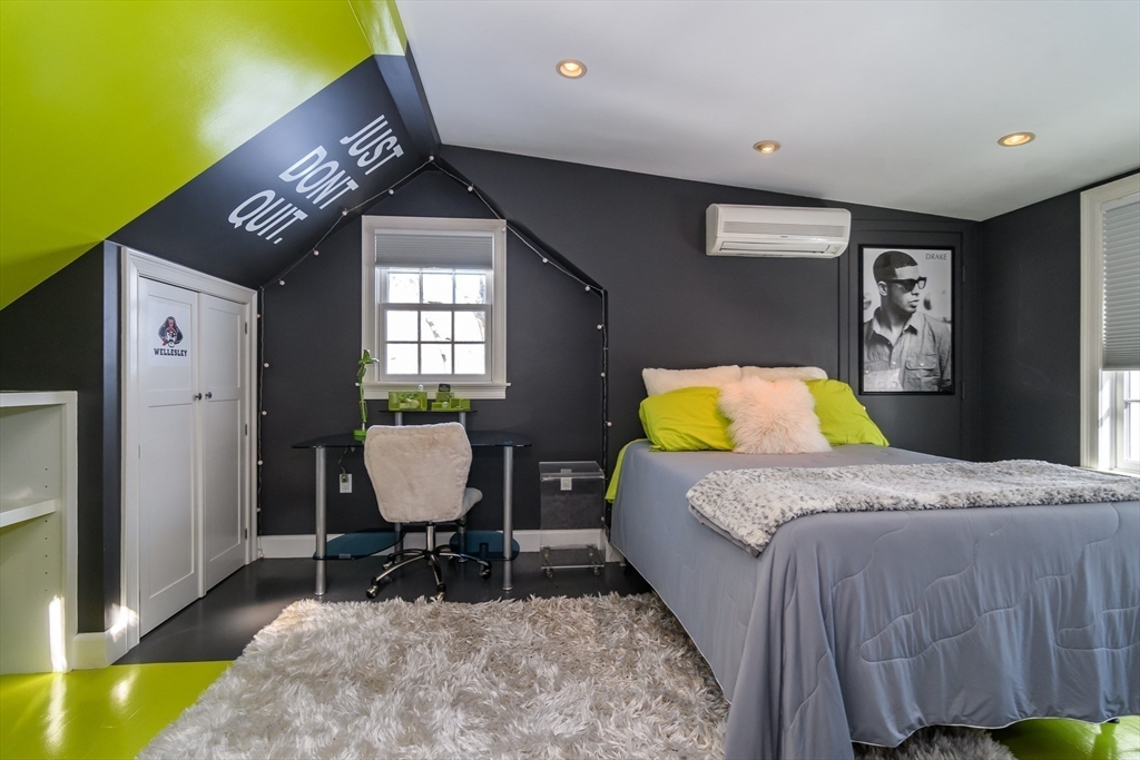 81 Audubon Road Wellesley, MA 02481 - Photo 21 of 25 a bedroom with a bed and chair