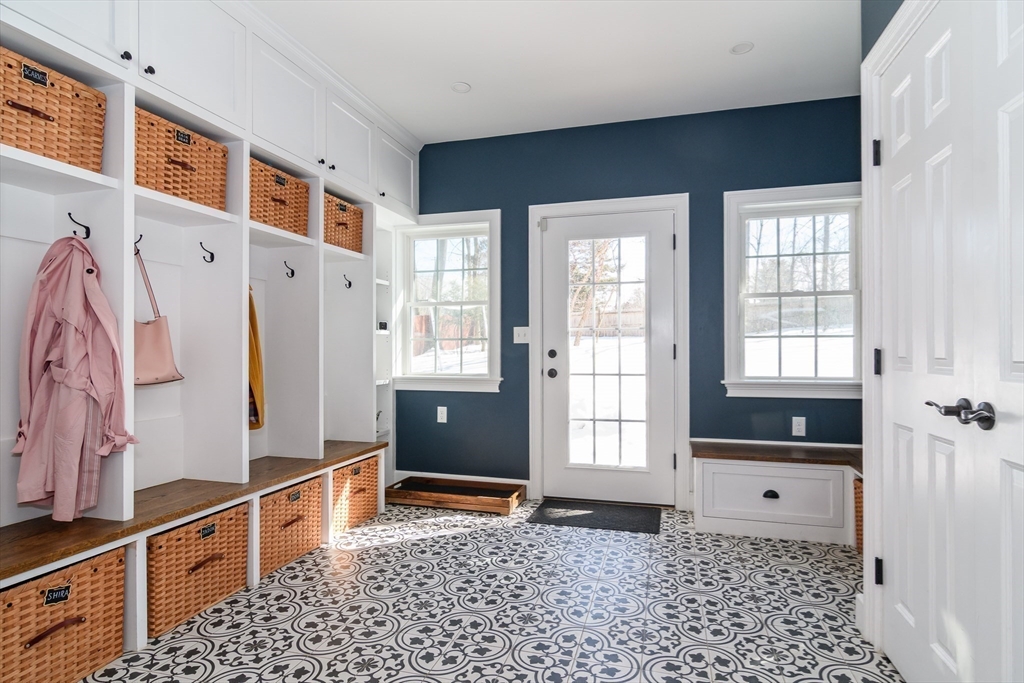 81 Audubon Road Wellesley, MA 02481 - Photo 23 of 25 a view of an entryway with wooden floor and windows