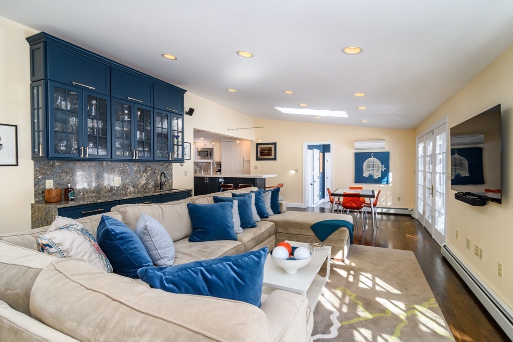 81 Audubon Road Wellesley, MA 02481 - Photo 3 of 25 a living room with furniture and a flat screen tv