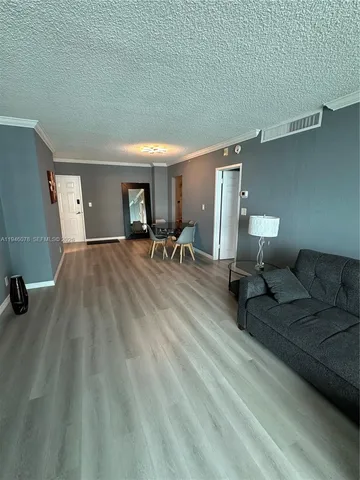 a view of a livingroom with furniture and windows