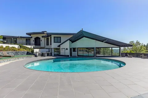 a front view of a house with swimming pool