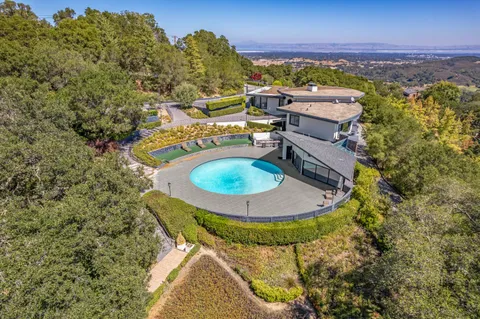 an aerial view of a house with outdoor space