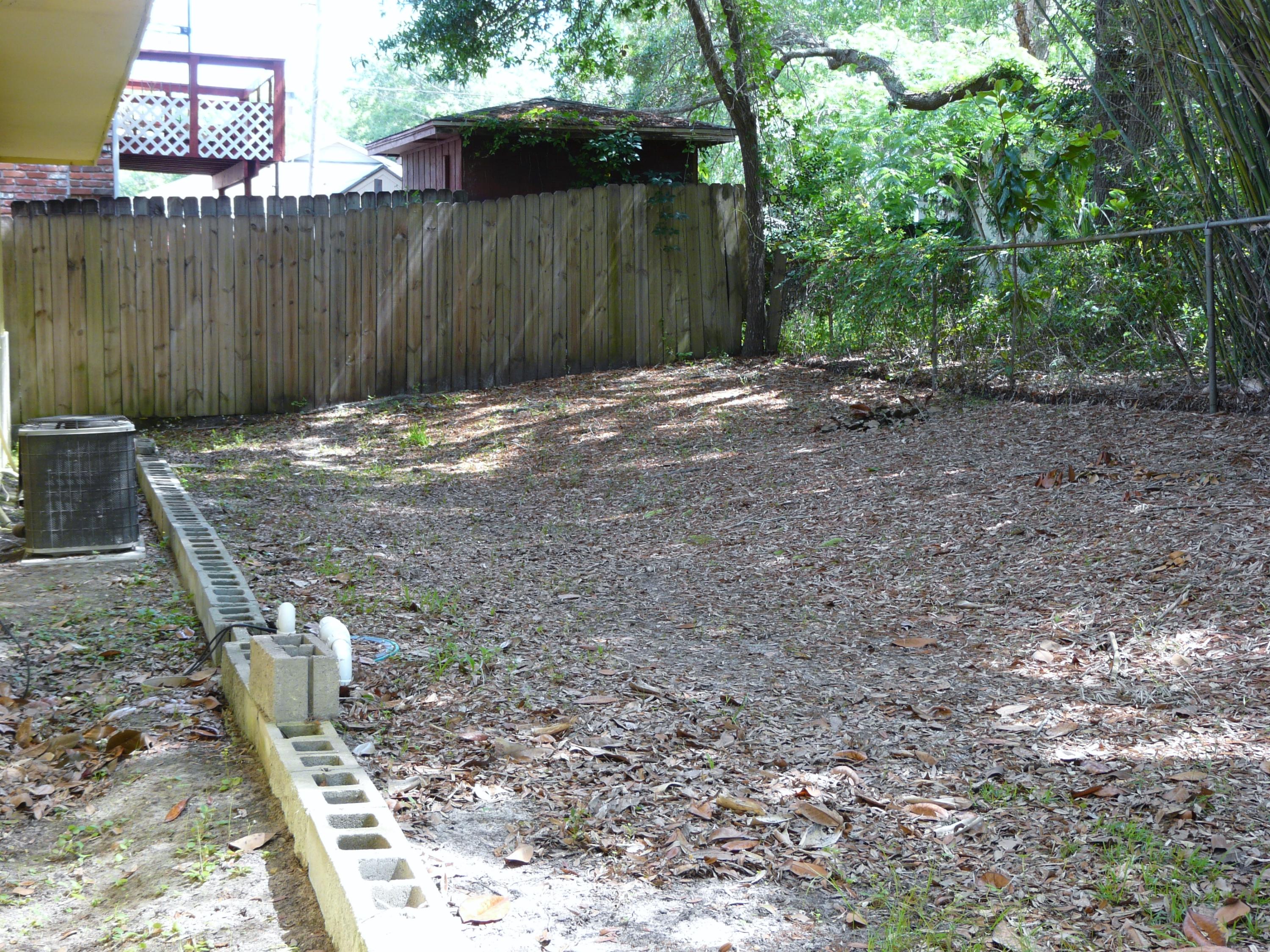 14 6th Street Shalimar, FL 32579 - Photo 12 of 23 a backyard of a house with lots of green space