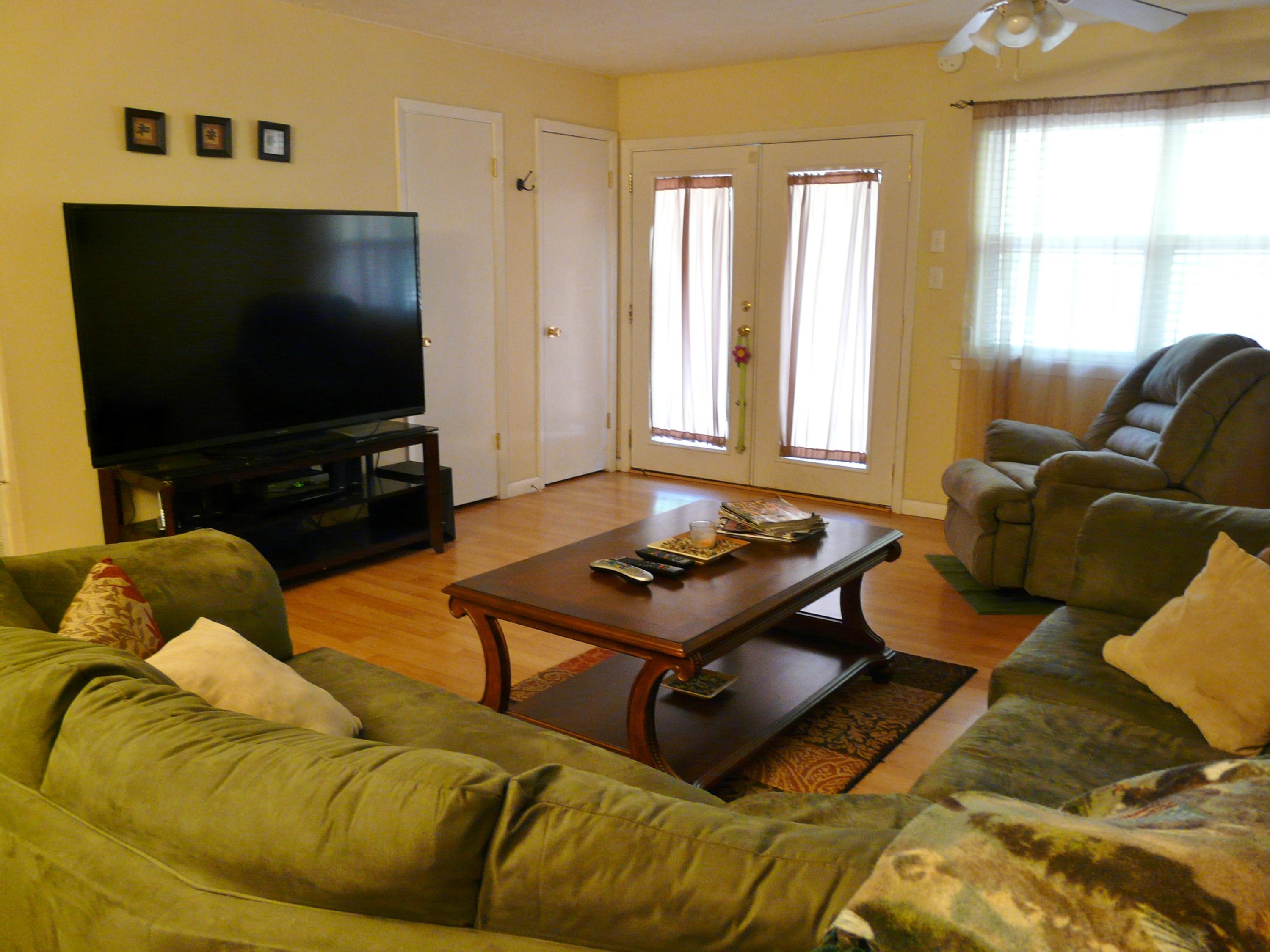 14 6th Street Shalimar, FL 32579 - Photo 19 of 23 a living room with furniture and a flat screen tv