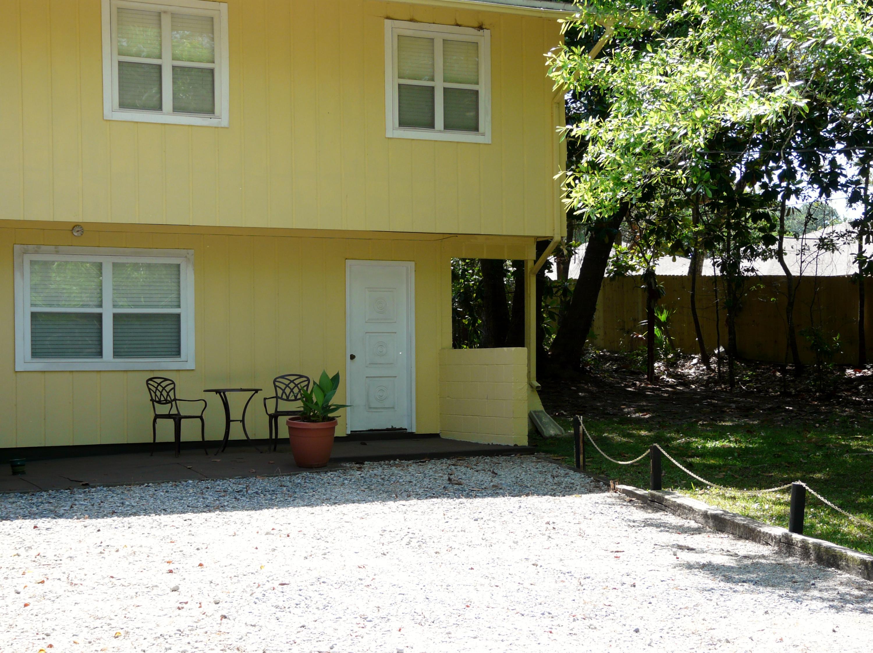 14 6th Street Shalimar, FL 32579 - Photo 5 of 23 a front view of a house with a yard
