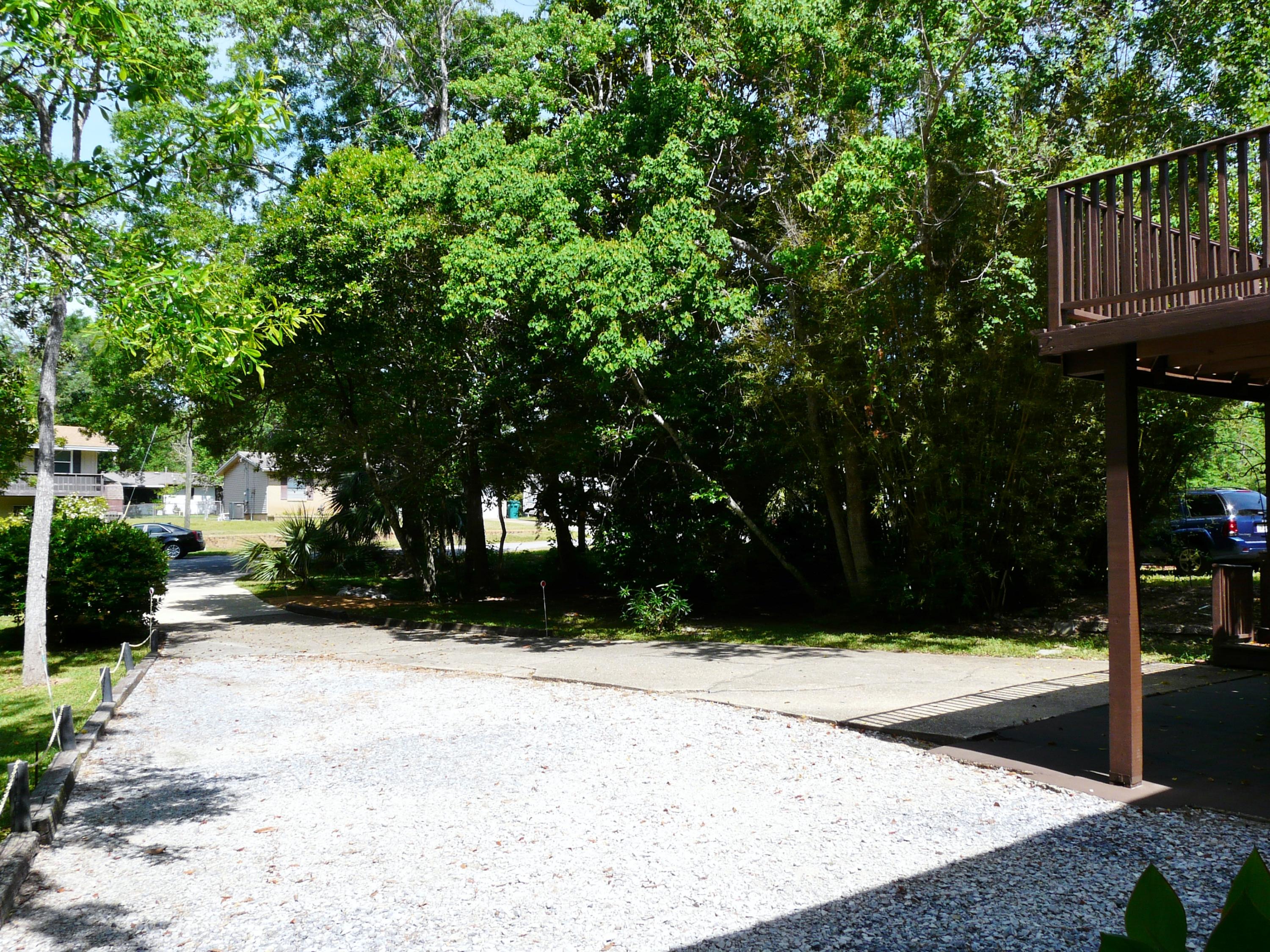 14 6th Street Shalimar, FL 32579 - Photo 9 of 23 a street view with wooden fence