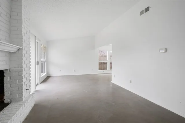 a view of empty room with windows