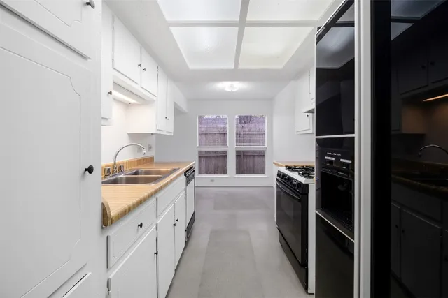 a kitchen with stainless steel appliances granite countertop a stove and a refrigerator