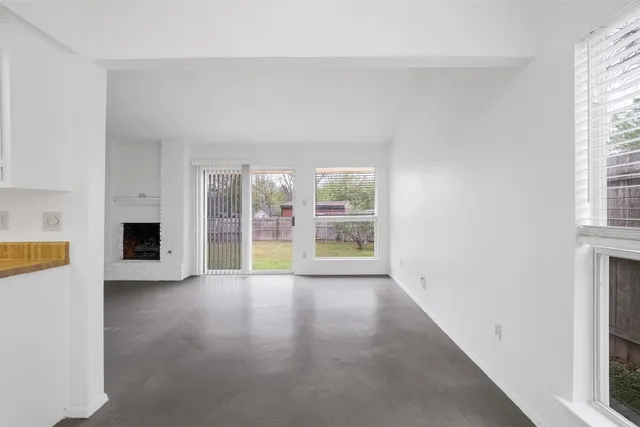 an empty room with windows