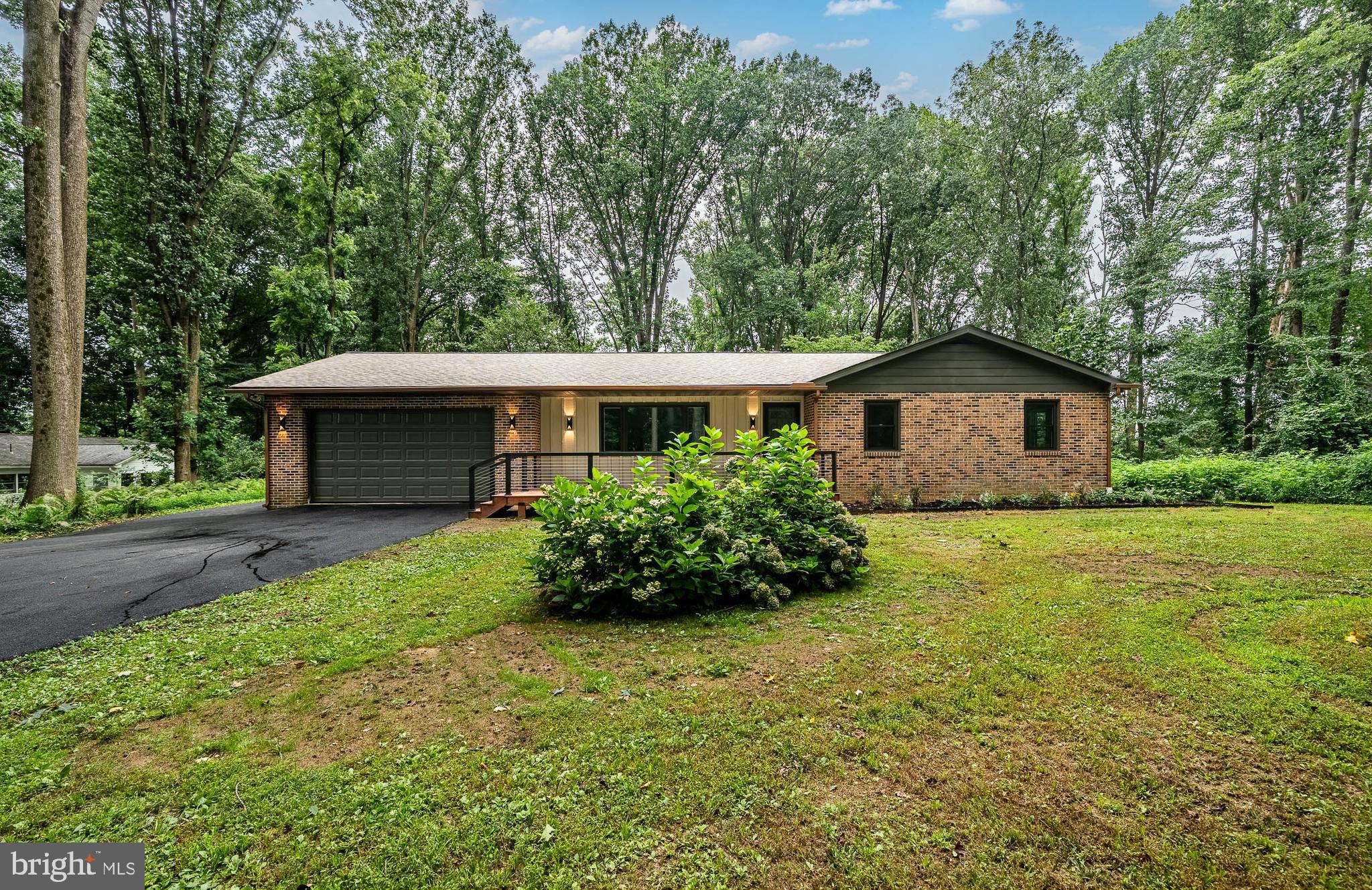 129 Chambers Road Toughkenamon, PA 19374 - Photo 2 of 60 a front view of a house with garden