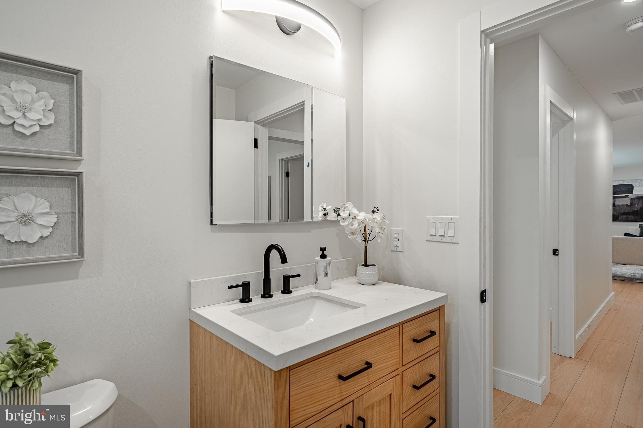 129 Chambers Road Toughkenamon, PA 19374 - Photo 26 of 60 a bathroom with a sink toilet and mirror