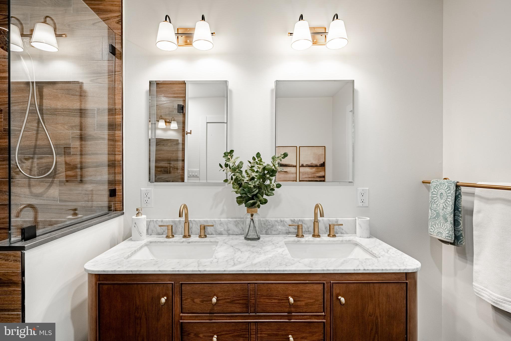 129 Chambers Road Toughkenamon, PA 19374 - Photo 33 of 60 a bathroom with a granite countertop sink a large mirror and shower