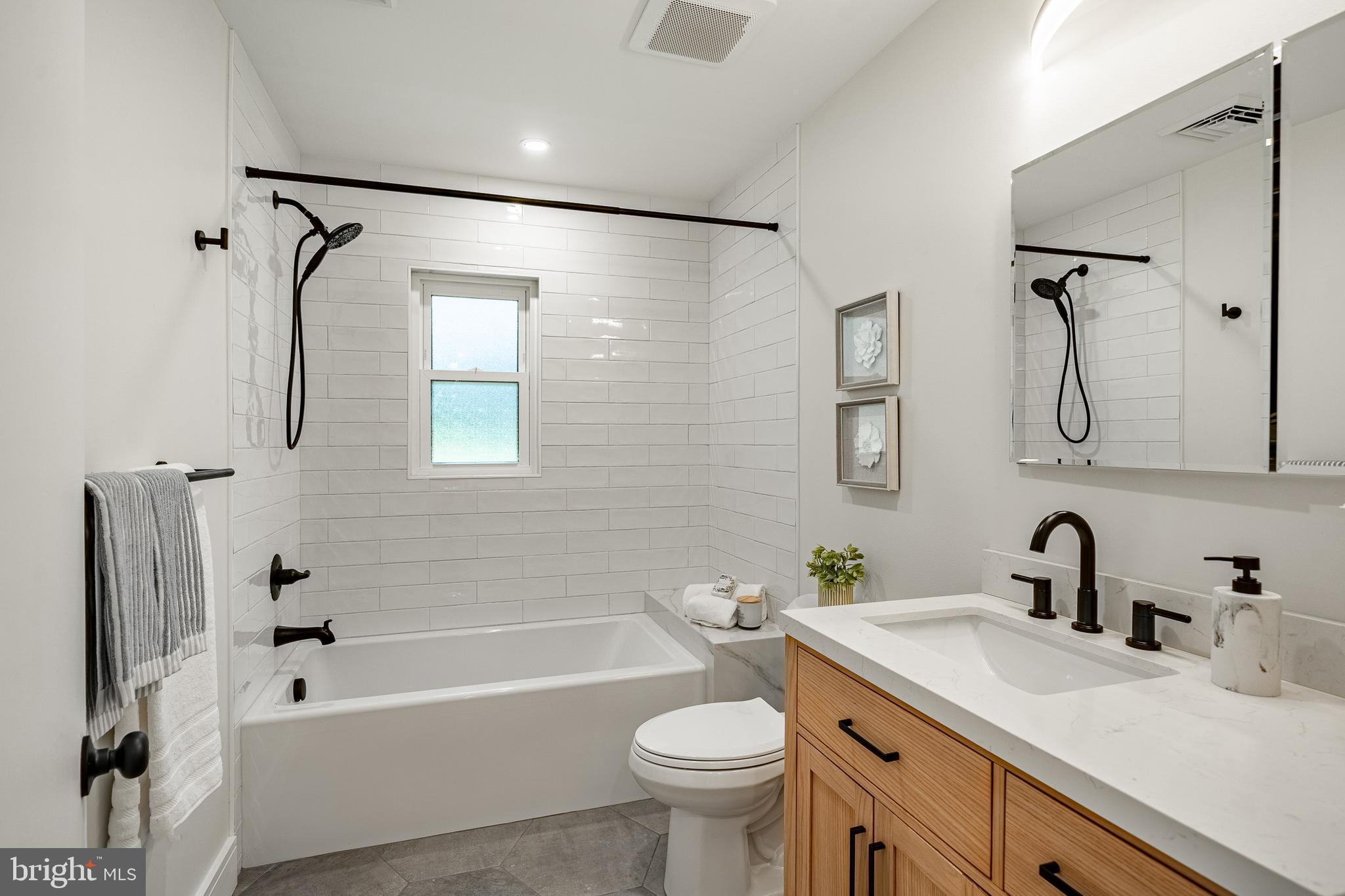 129 Chambers Road Toughkenamon, PA 19374 - Photo 40 of 60 a bathroom with a sink vanity granite toilet tub and shower