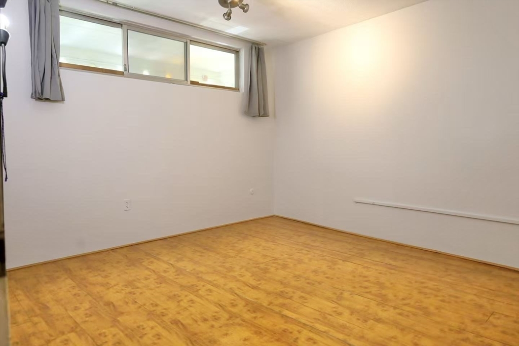 200 Swanton Street, Unit 237 Winchester, MA 01890 - Photo 8 of 14 a view of empty room with windows