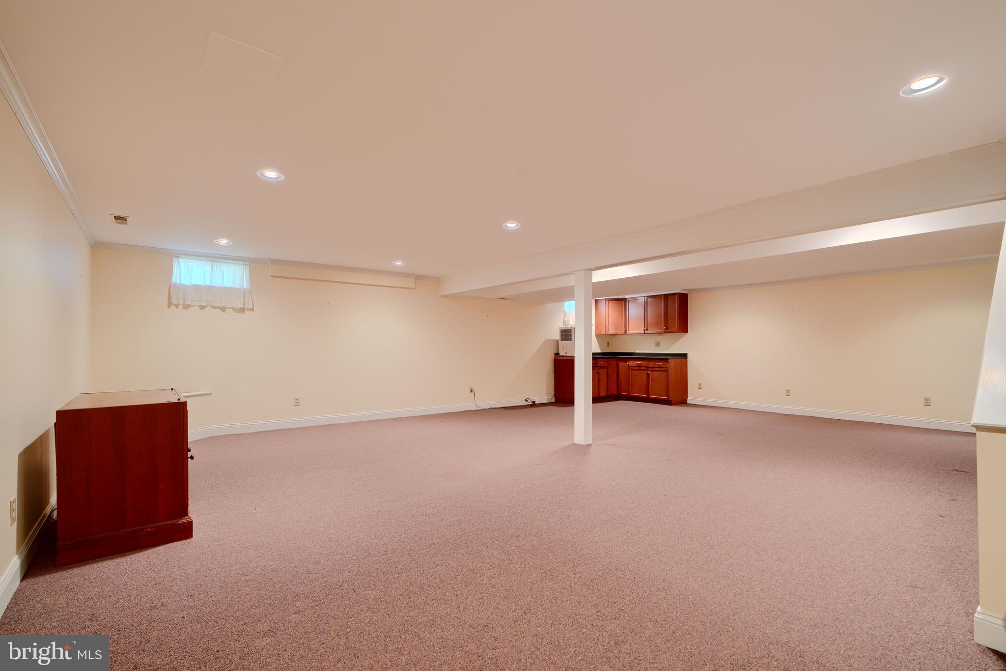 3330 Fallston Road Fallston, MD 21047 - Photo 29 of 41 an empty room with wooden cabinet and windows