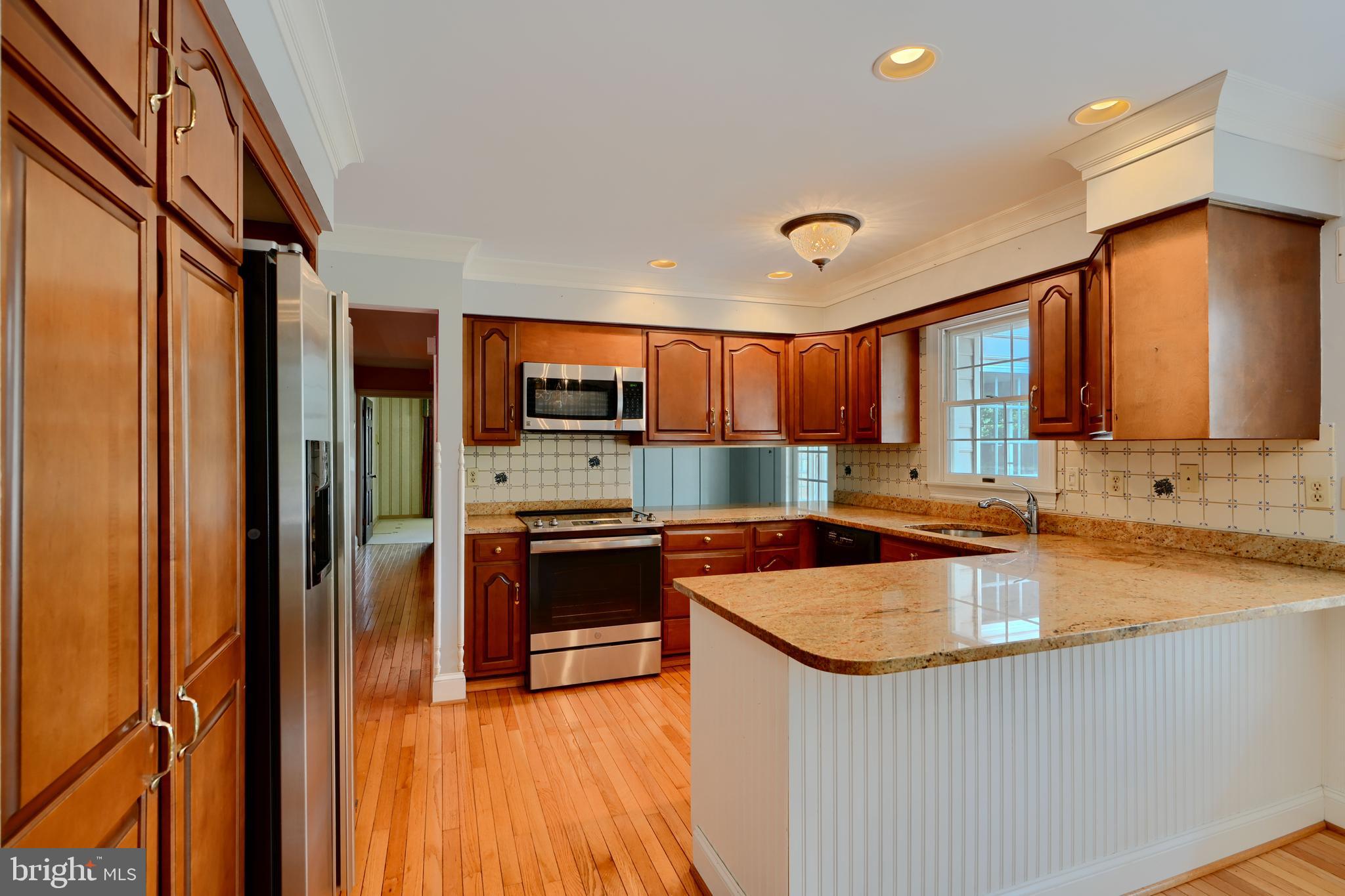 3330 Fallston Road Fallston, MD 21047 - Photo 7 of 41 a kitchen with stainless steel appliances granite countertop a sink stove and refrigerator