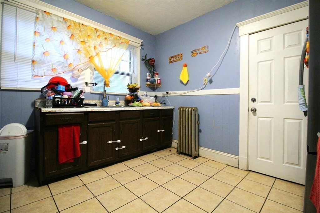 61 Kimberly Avenue Springfield, MA 01108 - Photo 11 of 39 a kitchen with a sink cabinets and appliances