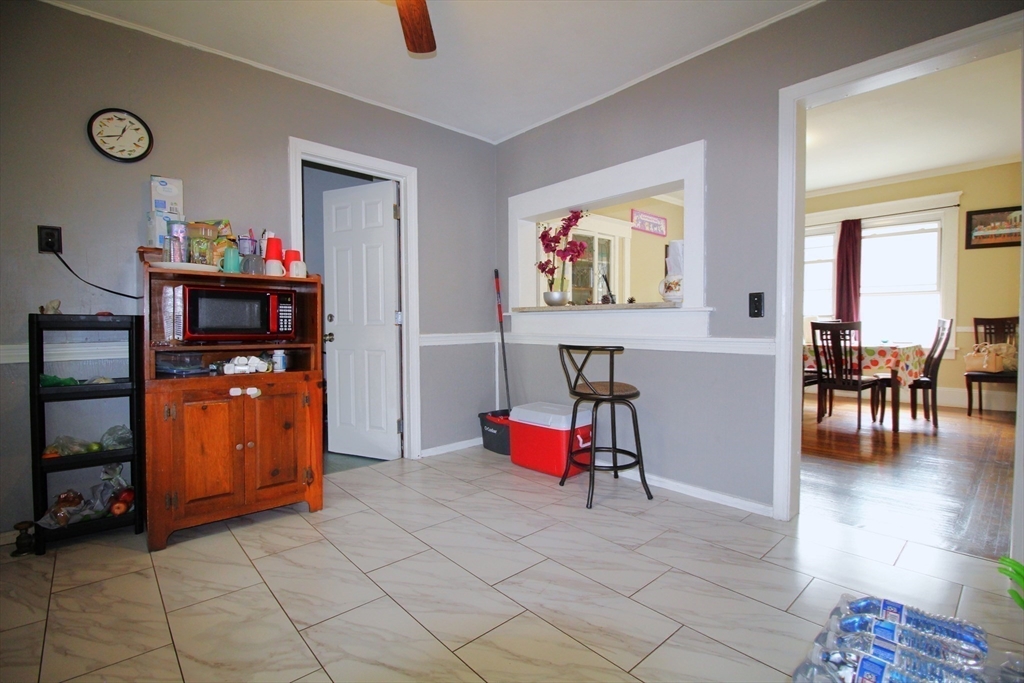 61 Kimberly Avenue Springfield, MA 01108 - Photo 22 of 39 a living room with furniture and a flat screen tv