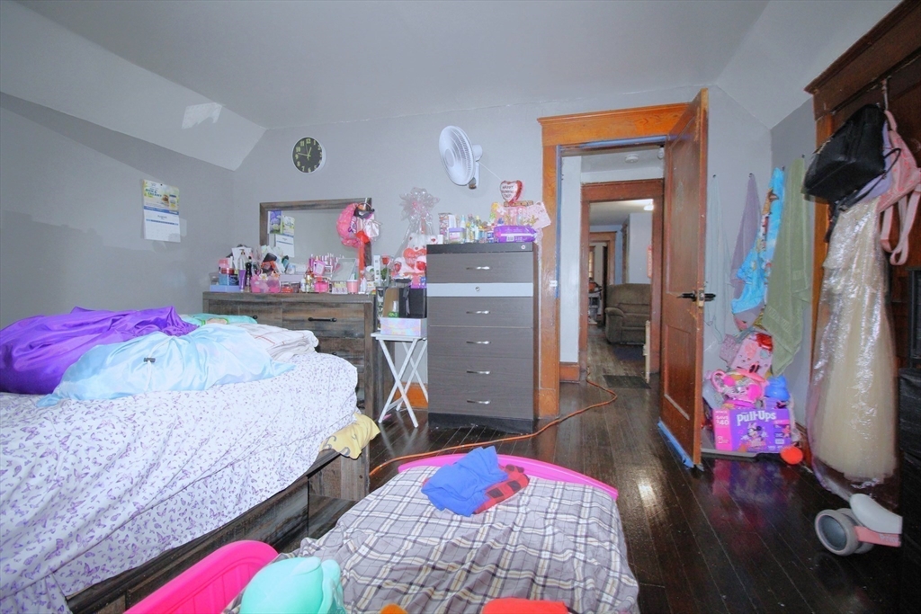 61 Kimberly Avenue Springfield, MA 01108 - Photo 29 of 39 a bedroom with a bed closet and flat tv screen