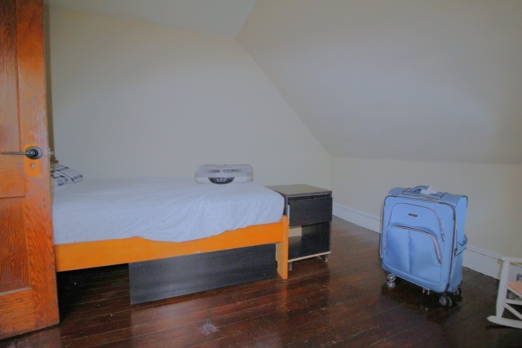61 Kimberly Avenue Springfield, MA 01108 - Photo 31 of 39 a room with a bed and wooden floor