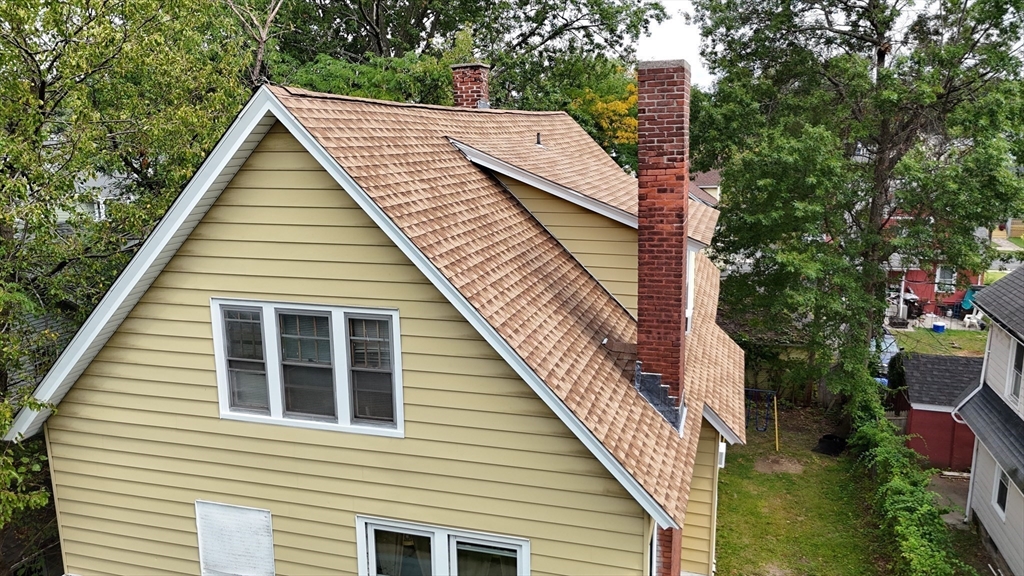 61 Kimberly Avenue Springfield, MA 01108 - Photo 33 of 39 a view of house with a small deck and a backyard