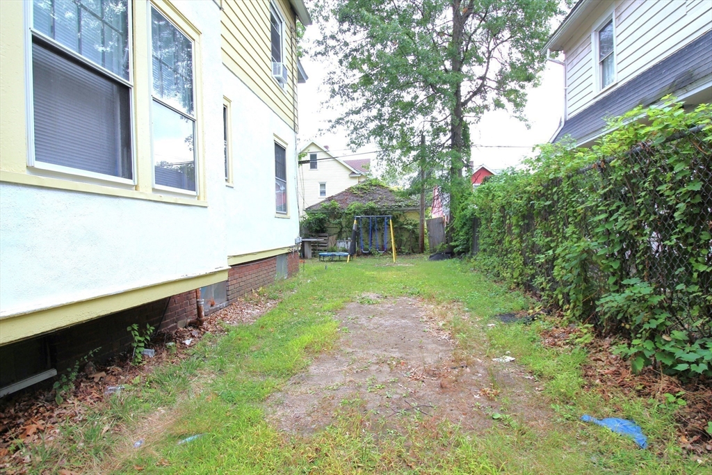 61 Kimberly Avenue Springfield, MA 01108 - Photo 4 of 39 a view of a house with a yard