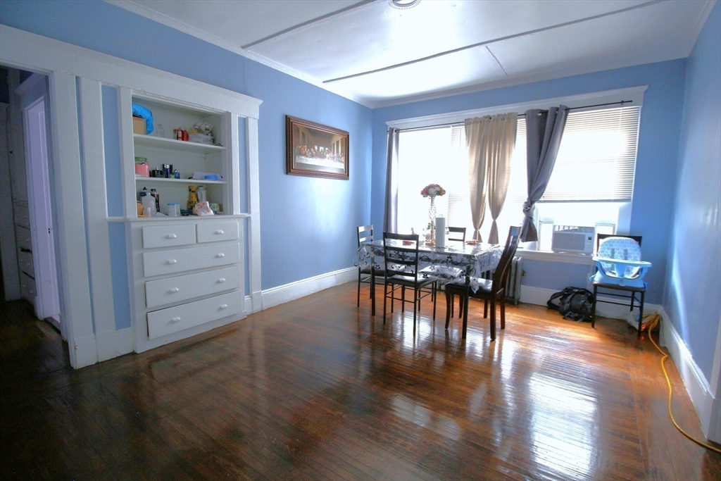61 Kimberly Avenue Springfield, MA 01108 - Photo 10 of 39 a living room with furniture and a large window