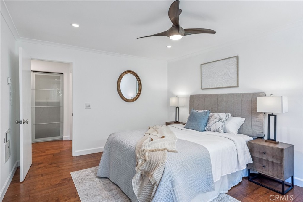 2015 Bataan Road, Unit 102 Redondo Beach, CA 90278 - Photo 14 of 43 a bedroom with a bed and a lamp