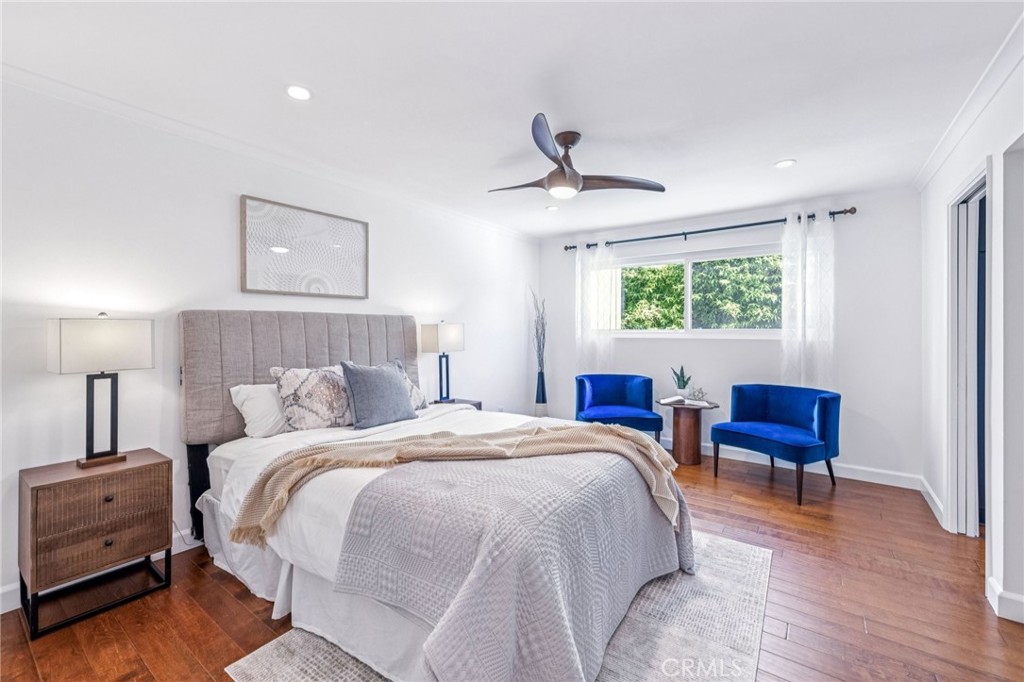 2015 Bataan Road, Unit 102 Redondo Beach, CA 90278 - Photo 16 of 43 a bedroom with a bed and a chair