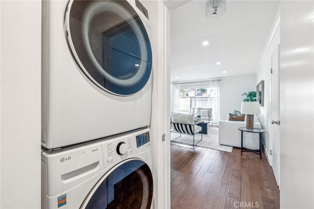 2015 Bataan Road, Unit 102 Redondo Beach, CA 90278 - Photo 18 of 43 a living room with furniture and a wooden floor