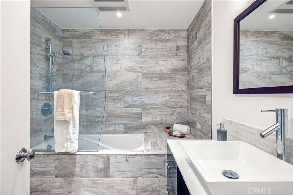2015 Bataan Road, Unit 102 Redondo Beach, CA 90278 - Photo 19 of 43 a bathroom with a bathtub and shower