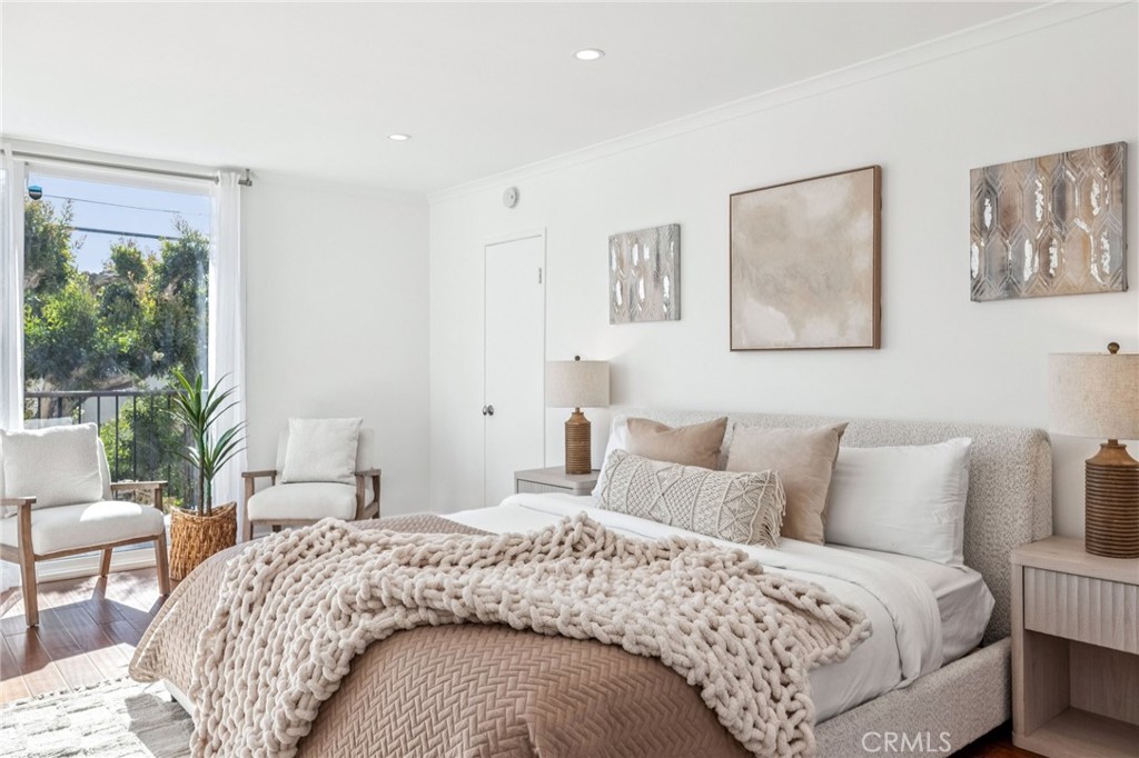 2015 Bataan Road, Unit 102 Redondo Beach, CA 90278 - Photo 21 of 43 a bedroom with a bed and a large window