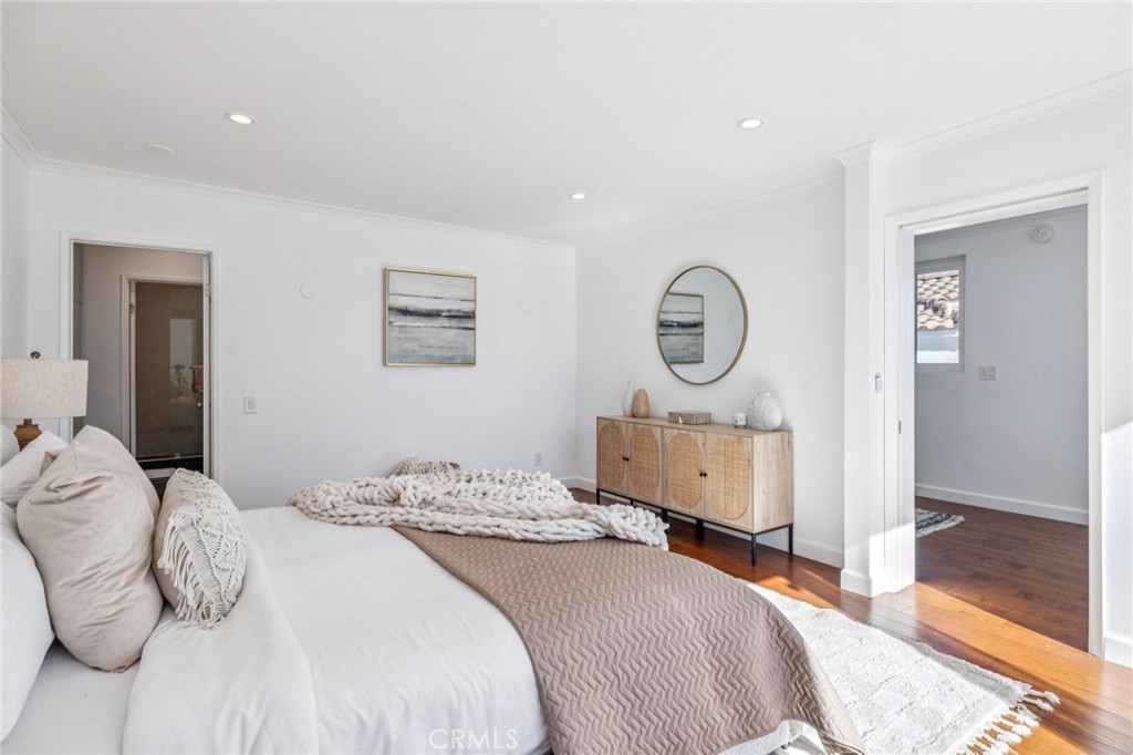 2015 Bataan Road, Unit 102 Redondo Beach, CA 90278 - Photo 24 of 43 a bedroom with a bed and a table in it